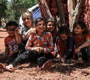 A group of smiling children sitting together