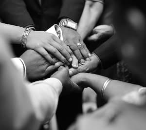 Hands stacked together in unity