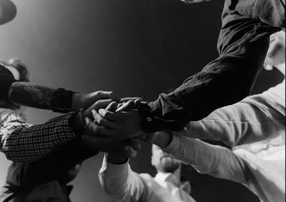 Hands joined together in support