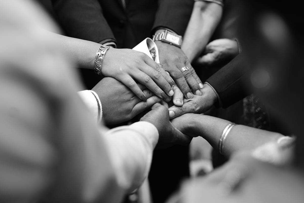 Hands stacked together in unity