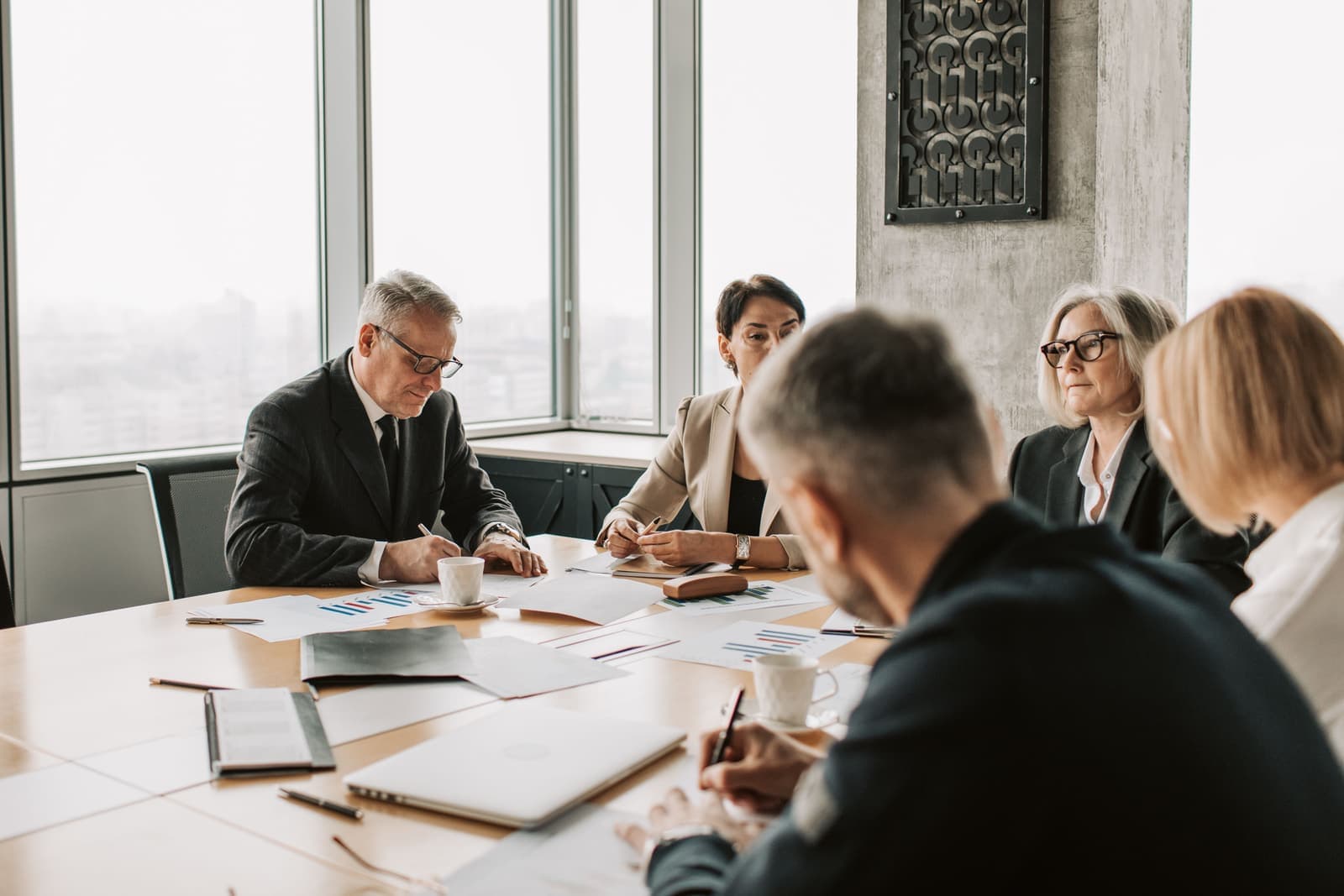 Colleagues meeting around a conference table
